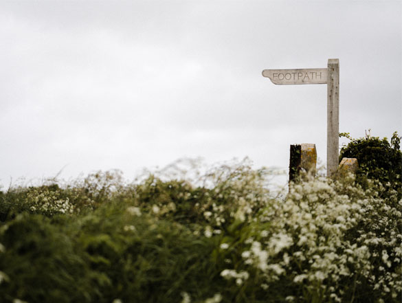 Photo of an old style footpath sign in the countryside